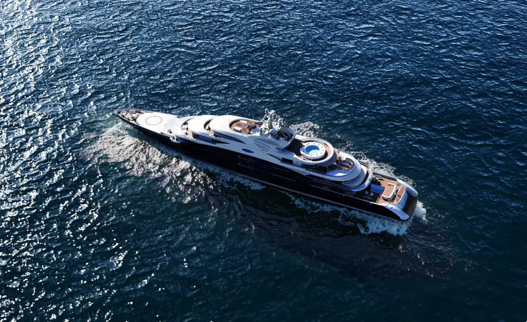 Aerial superyacht view in yacht rendering portfolio showing decks and open sea wake