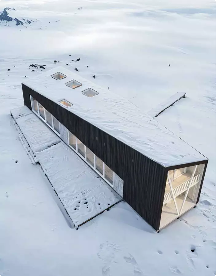 Architectural Rendering Process: 7 Key Stages for Better Project Visualization Minimalist cabin in snowy landscape with skylights and glass walls, Architectural Rendering Process