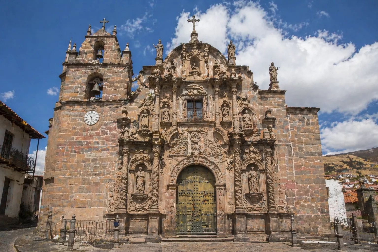 Baroque Architecture: Europe’s Boldest Expression of Power and Beauty Baroque church facade with ornate carvings and statues under blue sky, Baroque Architecture