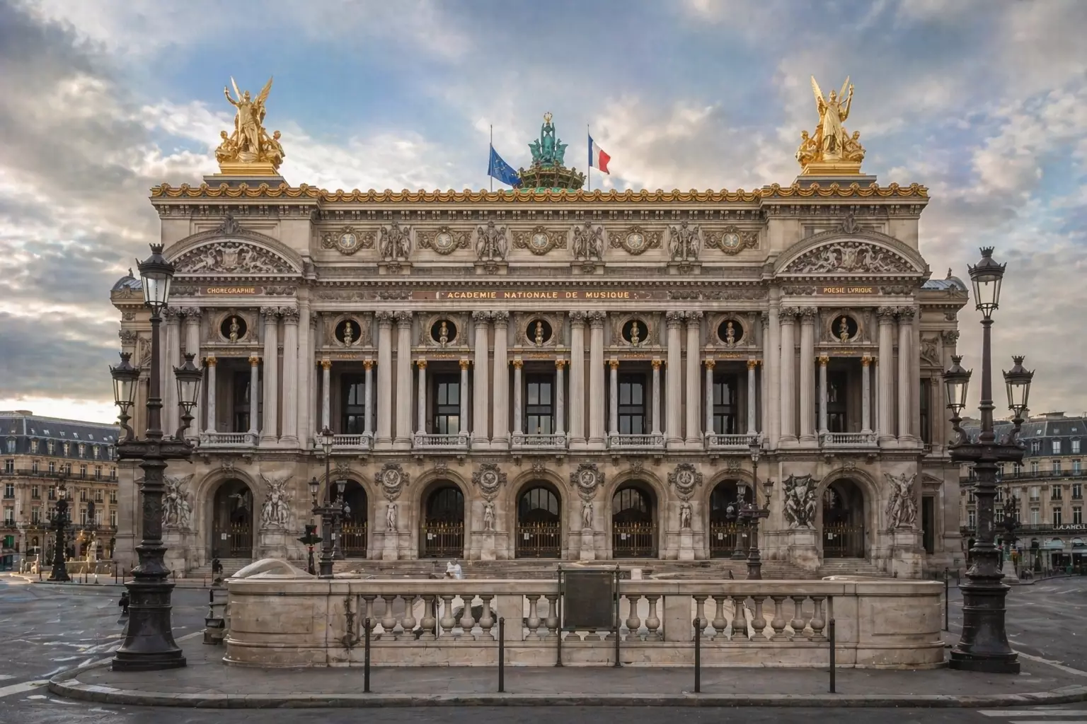 Baroque Architecture: Europe’s Boldest Expression of Power and Beauty Opera house facade with columns statues and lamps at dusk, Baroque Architecture