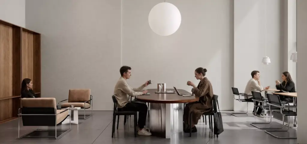 Minimal cafe interior CGI with shared wood tables, lounge seating, and people drinking coffee