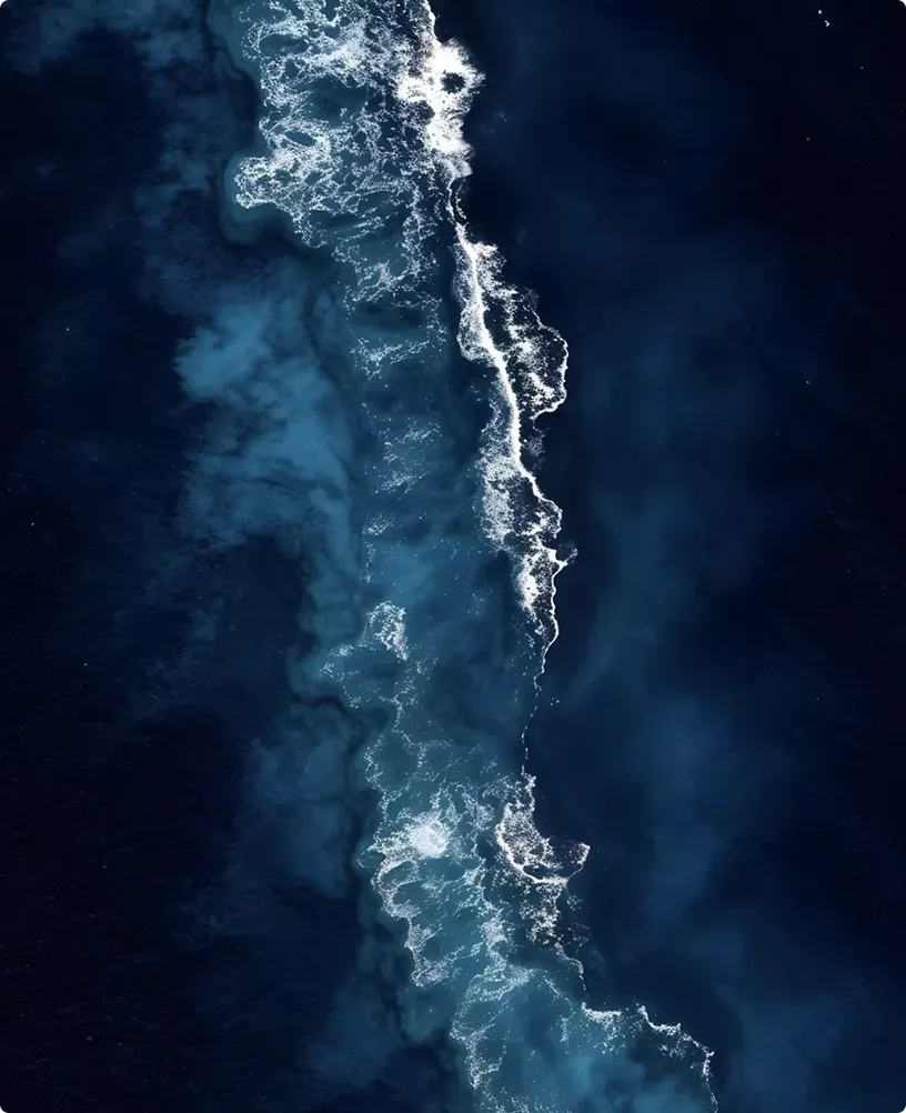 CGI campaign visuals for LARQ inspired aerial ocean waves with glowing water textures