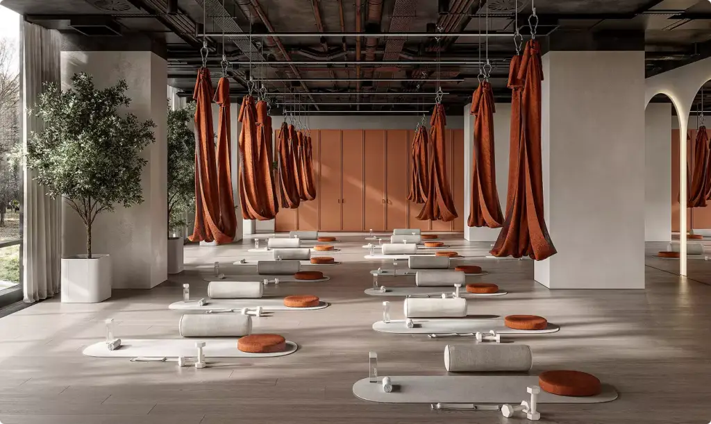 Commercial Rendering of modern wellness studio with suspended fabric hammocks