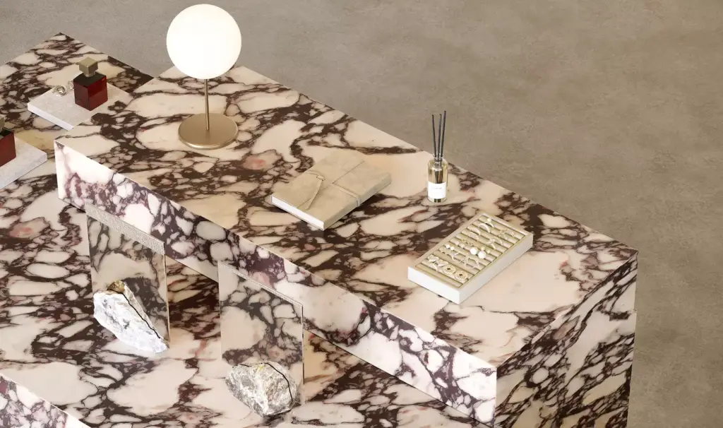Decorative marble display surface in a luxury beauty retail store featuring curated beauty products and refined accessories.