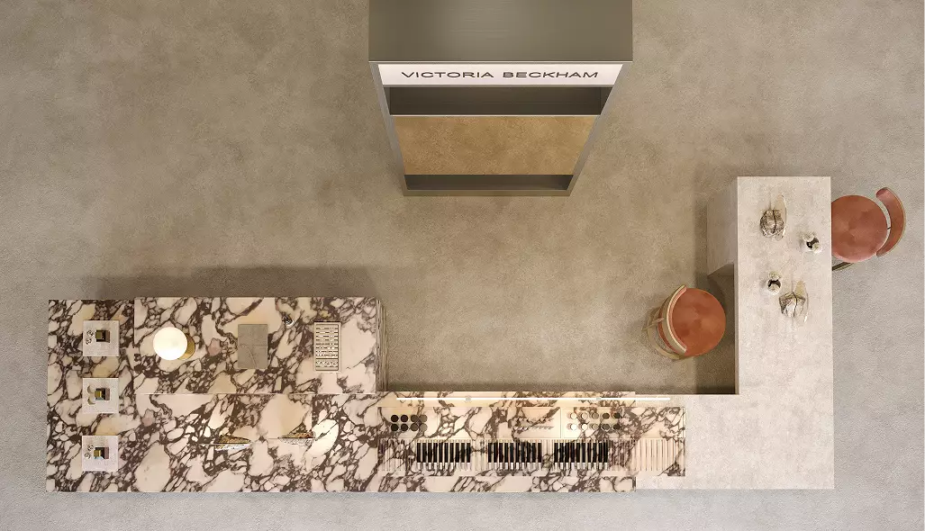 Top-down layout of a luxury beauty retail kiosk with integrated cosmetic displays, consultation area, and marble merchandising surfaces.