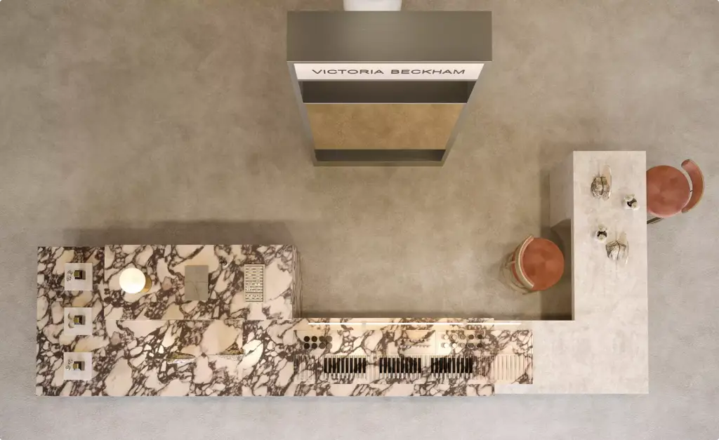 Overhead view of a luxury beauty retail display with premium cosmetic product organization and sophisticated marble surfaces.