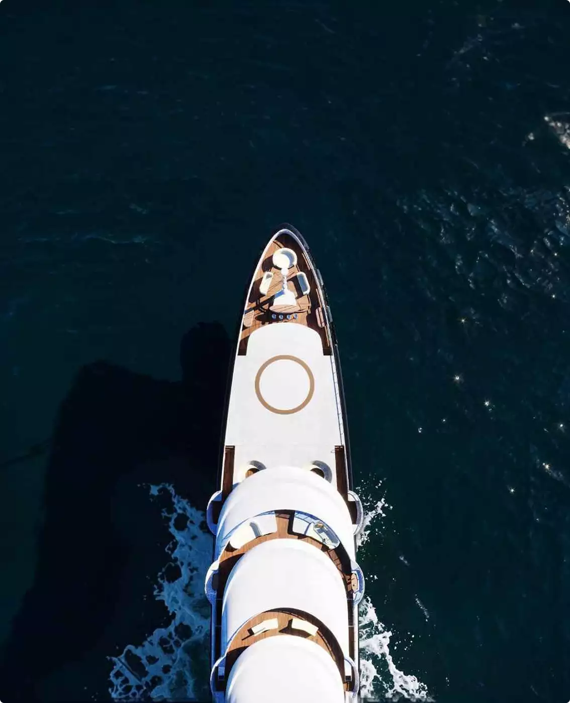 Luxury yacht CGI visualization with aerial top view of the yacht moving through dark water