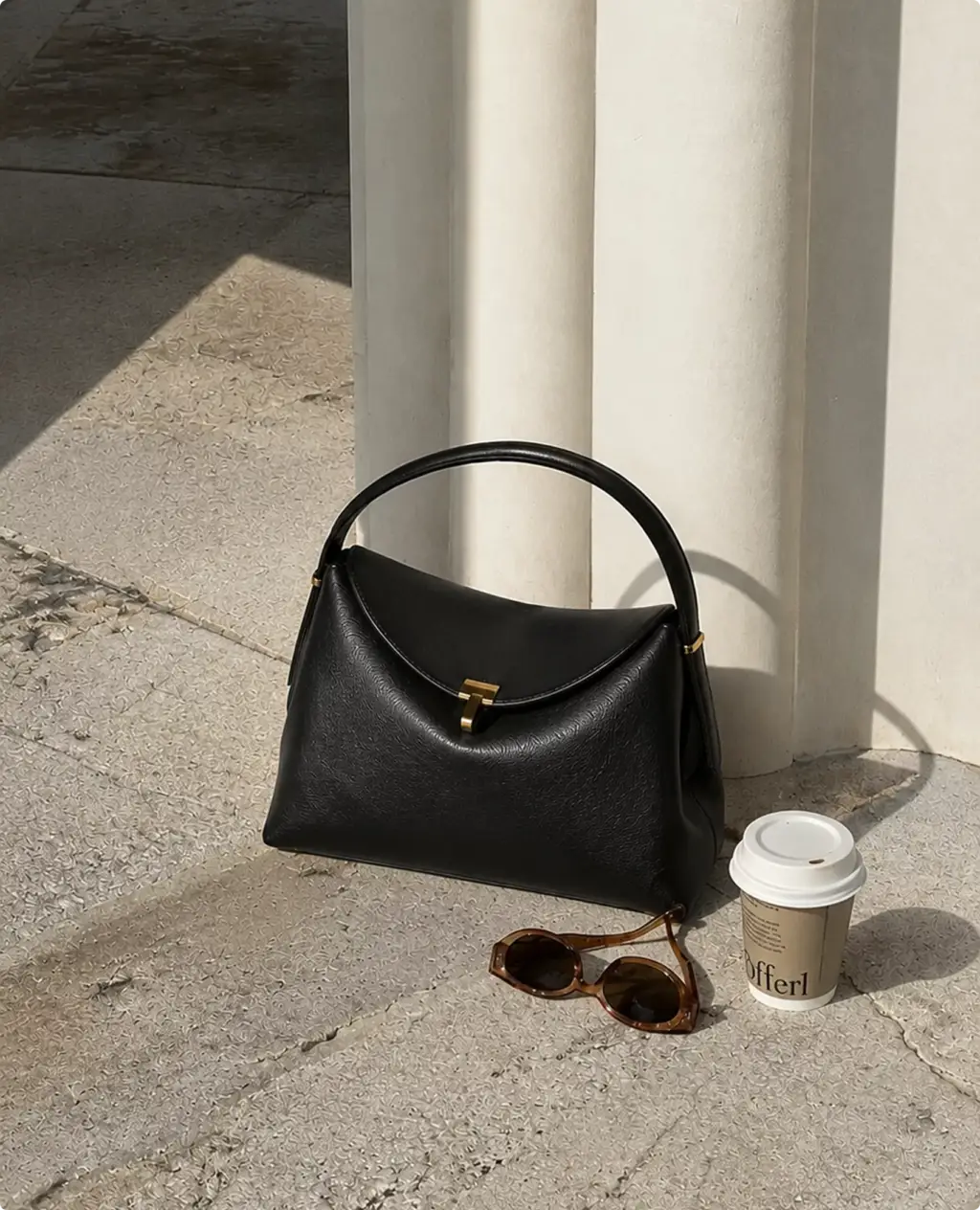 Photorealistic Toteme handbag CGI render beside sunglasses and coffee cup