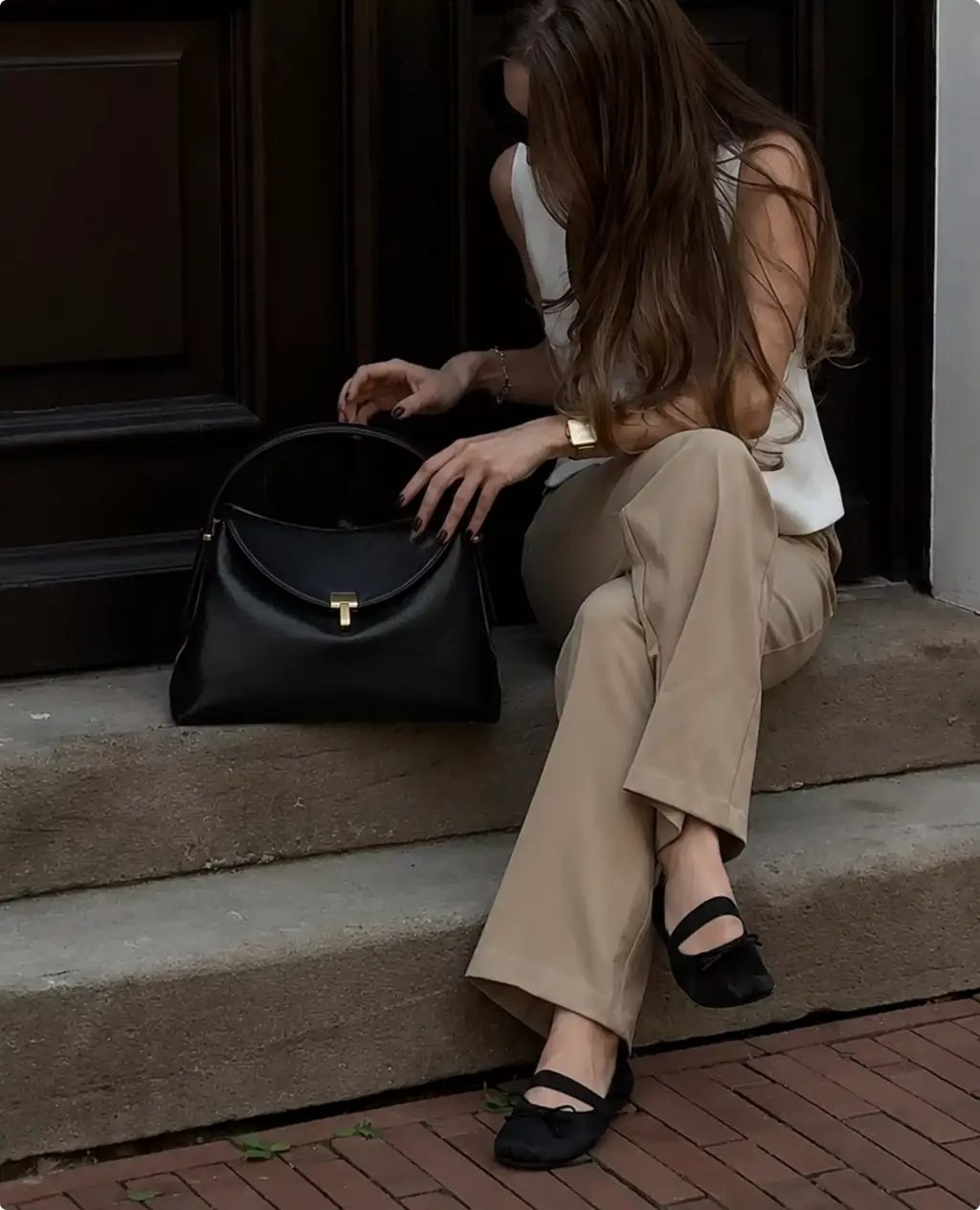 Photorealistic Toteme handbag CGI render with woman seated on stone steps