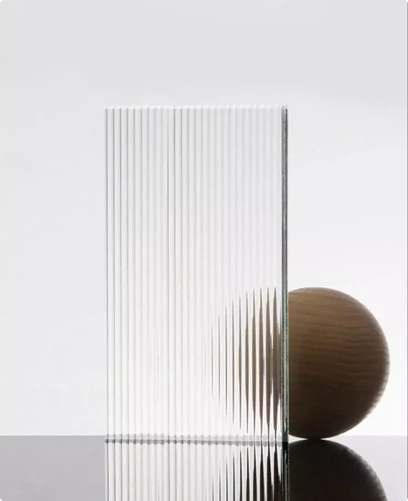 Textured ribbed glass panel with sphere behind it, wall light visualization material study
