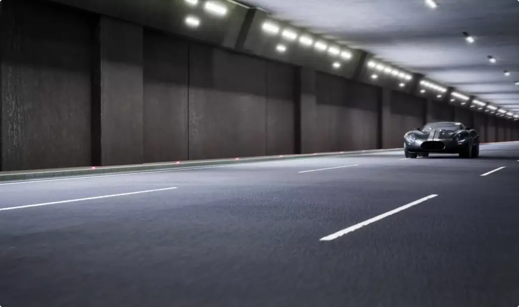 Automotive CGI renders of a sports coupe driving through a tunnel from a distant view