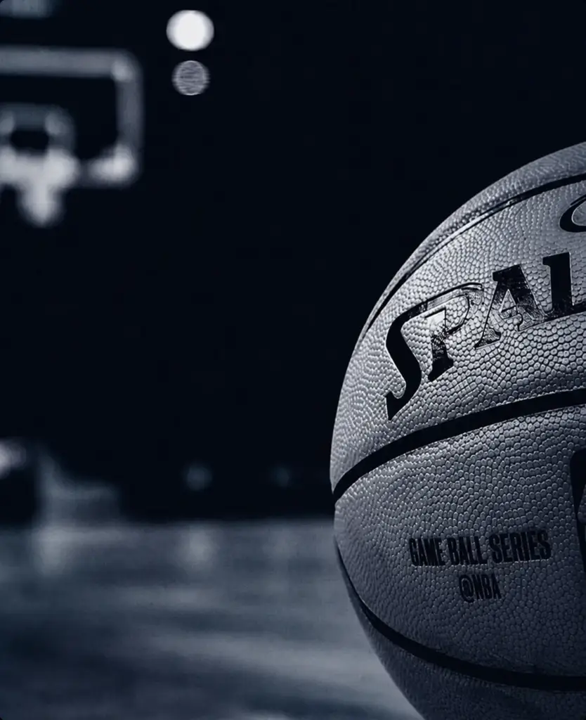 Close-up of a basketball on a dark background, sports brand world.