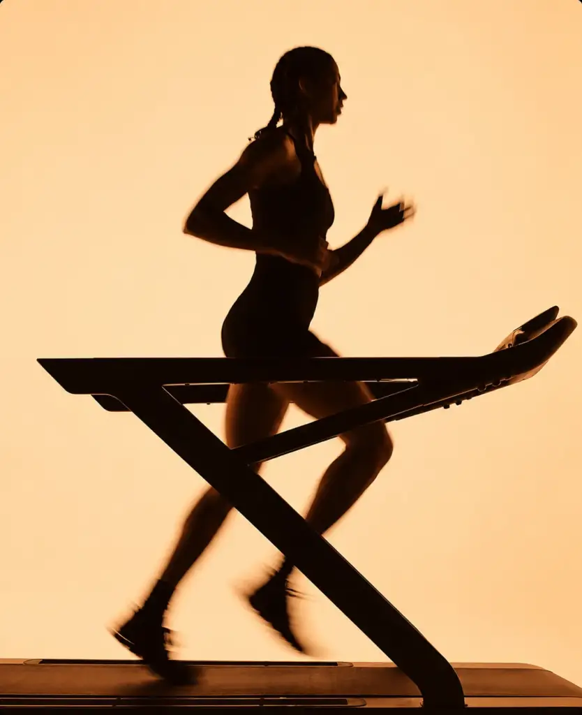 Endurance runner silhouette on a warm background, brand world.