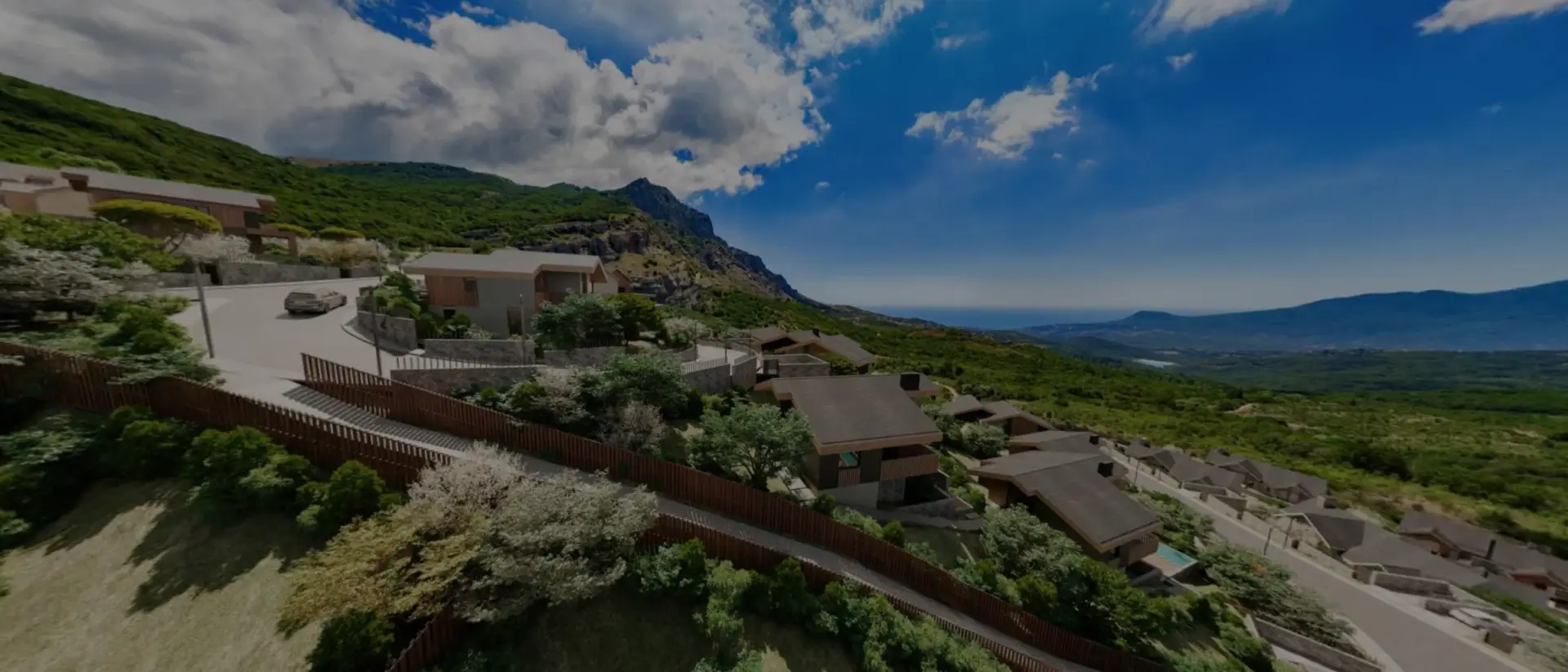 Wide sky panorama with dramatic clouds over mountainous terrain