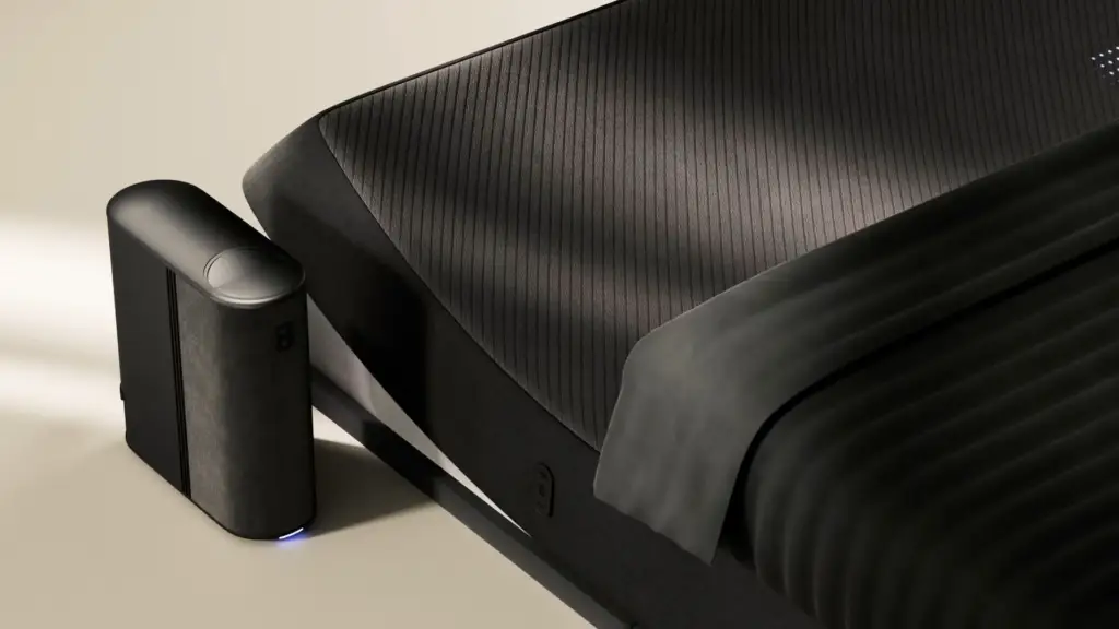 Product rendering of a black smart bed with a temperature-control hub