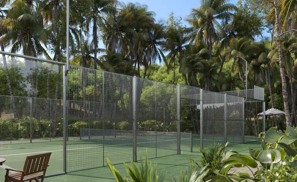 Side-view tropical CGI of the private padel court with sand-tone surface and palm canopy filtering golden-hour light.